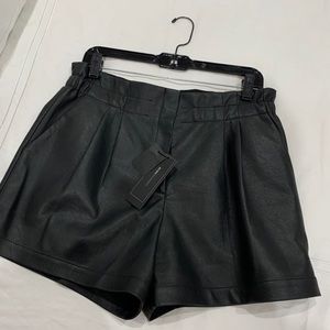 BCBG Black patent shorts